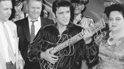 Image result for images of  Elvis with his parents, 1956.