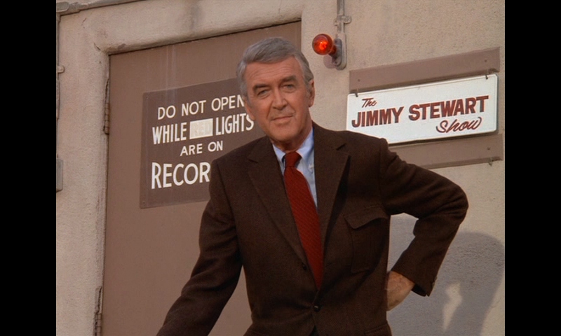 Jimmy Stewart posing outside the filming studio. 